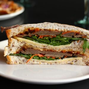 Close-up of a hearty sandwich with fresh ingredients, ready to enjoy.